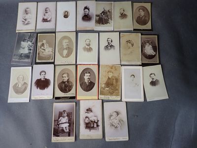 an old photo of a bunch of people sitting on top of a table