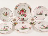 a group of plates and cups with flowers on them