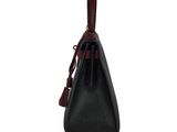 a black and red handbag on a white background