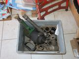 a box full of tools on the floor of a room