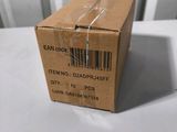 an empty box sitting on top of a table next to a white chair