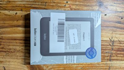 packaging of a tablet computer sitting on top of a wooden table