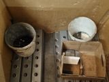 a box that has a bucket in it and a bucket in it