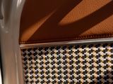 a close up view of a chair with a brown seat
