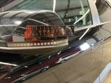 a close up of a car ' s side mirror with a sticker on it
