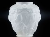 a white vase that is sitting on a table