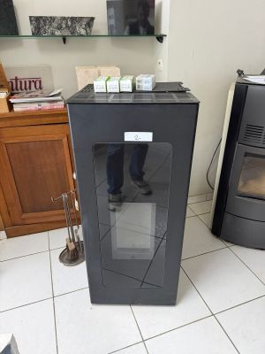a black stove sitting in a kitchen next to a black stove