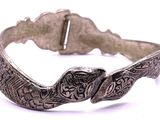 an image of a silver bracelet with a snake on it ' s side