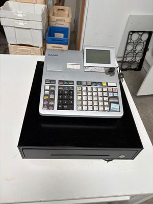 a calculator sitting on top of a table in a room