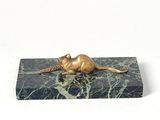 statue of a mouse on a marble block on a white background
