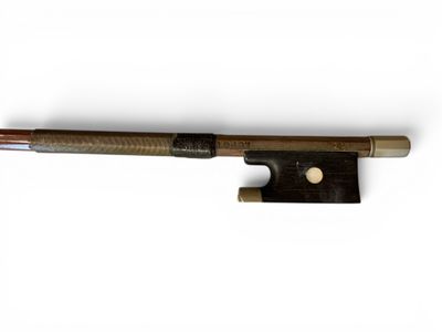 a close up of a violin bow on a white background