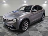 the grey alfa suv is parked on a checkered tile floor