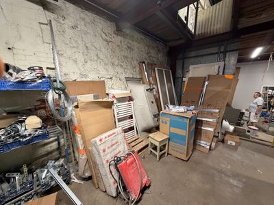 a room filled with lots of boxes and tools