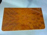 an image of a wooden cutting board on a white table