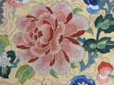 a close up of a plate with flowers and birds on it