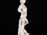 a white statue of a woman with a purse on a black background