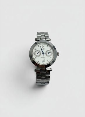 a close up of a watch on a white surface with a white background