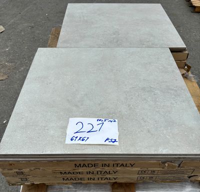 a box of concrete blocks on a pallet with a price tag on it