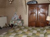a bed with a quilt on it in a bedroom