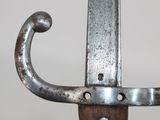 a close up of a metal object on a wooden stand