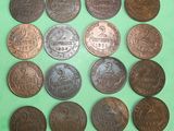 a close up of a bunch of coins on a green surface