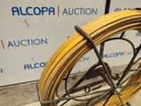 a yellow hose that is sitting on top of a cart