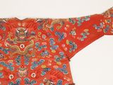 an image of a red jacket with blue and yellow designs on it