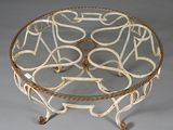 a glass table with a metal base and a glass top