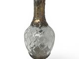 a glass vase with a metal base on a white background