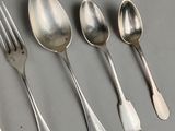 a lot of spoons and spoon spoons on the table