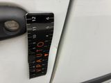 a measuring tape on the door handle of a car