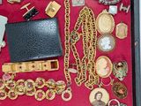 a display case with many different types of jewelry in it