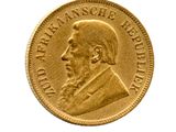 l'image d'une pièce d'or sur laquelle figure le visage d'un homme