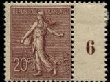 a stamp with an image of a woman holding a tennis racquet