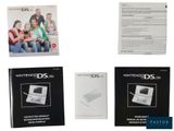 four nintendo ds manuals are shown on a white background