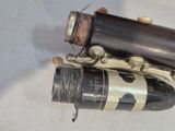 a wine bottle with a cork and a cork stopper attached to it