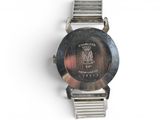 a close up of a wrist watch on a white surface