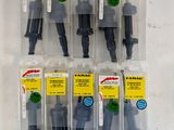 a set of six assorted water hoses in plastic packages