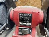 a red machine that is sitting on the ground