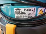 a close up of a blue machine with a yellow handle
