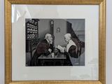 a picture of a man and a woman sitting at a table