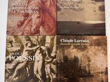 trois livres sur une table blanche sur fond blanc