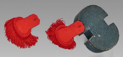 pair of red and blue horse head cuff earrings with tassels
