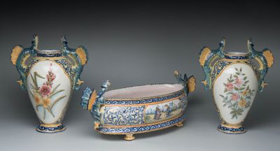 three vases sitting next to each other on a table