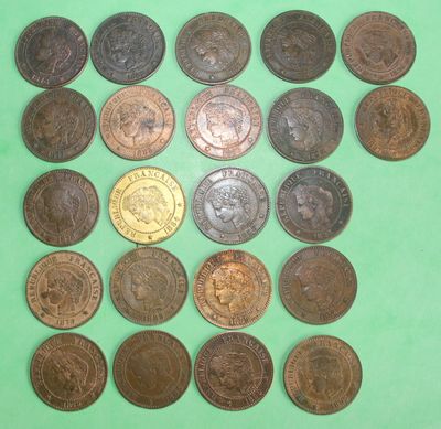 a close up of a bunch of coins on a green surface
