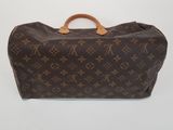 louis vuitton monogram canvas travel bag with brown leather handles