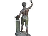 bronze statue of a boy with a bird in his hand