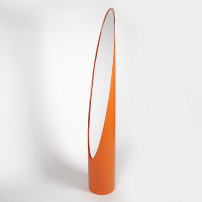 an image of a tall orange vase with a mirror on it