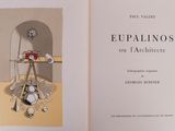 an open book with a picture of a table and a clock on it