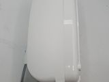 an overhead view of a white wall mounted device on a white surface